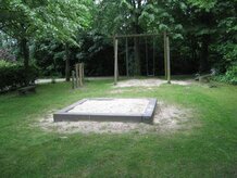 Sandkasten auf dem Spielplatz Drosselweg